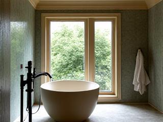 A handcrafted ceramic tub as the centerpiece of a luxurious bathroom